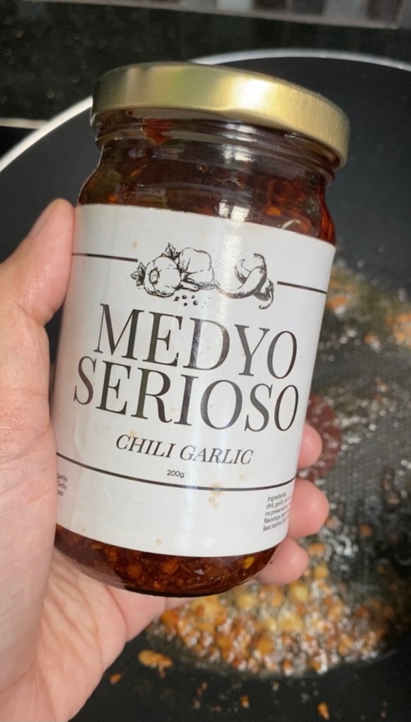 A bottle of Medyo Serioso Chili Garlic