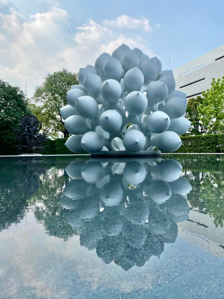 White art structure in the middle of a pool