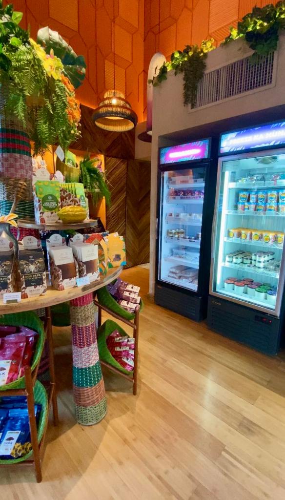 corner of a cafe with chocolate retail products including bars of chocolate and ice cream